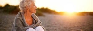 woman on beach at sunset