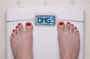 bathroom scale reads OMG