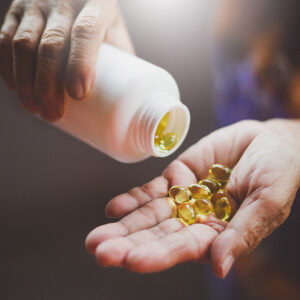 Pills being poured into a hand.