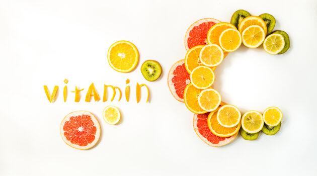 Vitamin C spelled out with citrus fruit slices