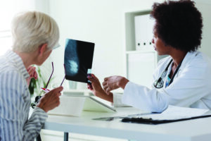  Doctor and patient looking at mammogram results