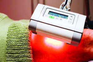 Low-level light therapy treating a patient's knee