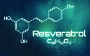 Chemical formula of Resveratrol C14H12O3 on a futuristic background