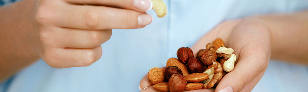 Close up of a handful of heart healthy nuts