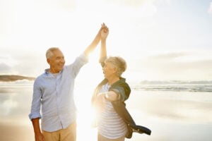 Happy senior couple dancing in the healthy sunlight