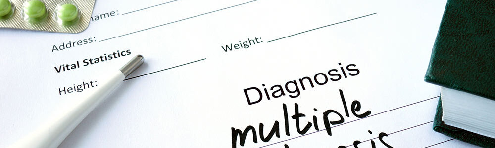 Doctor's diagnosis pad of paper with the words multiple sclerosis or MS written on it