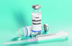 Influenza Flu Vaccine vials with syringe
