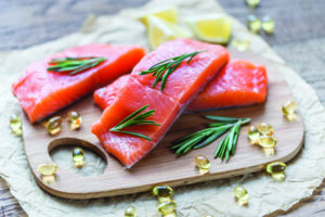 Fresh salmon on a cutting board.