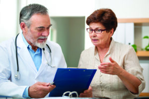 Doctor and patient reviewing health screening