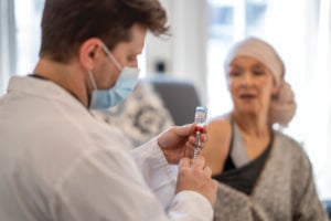 A patient receiving mRNA vaccine from doctor.