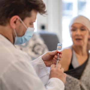 A patient receiving mRNA vaccine from doctor.